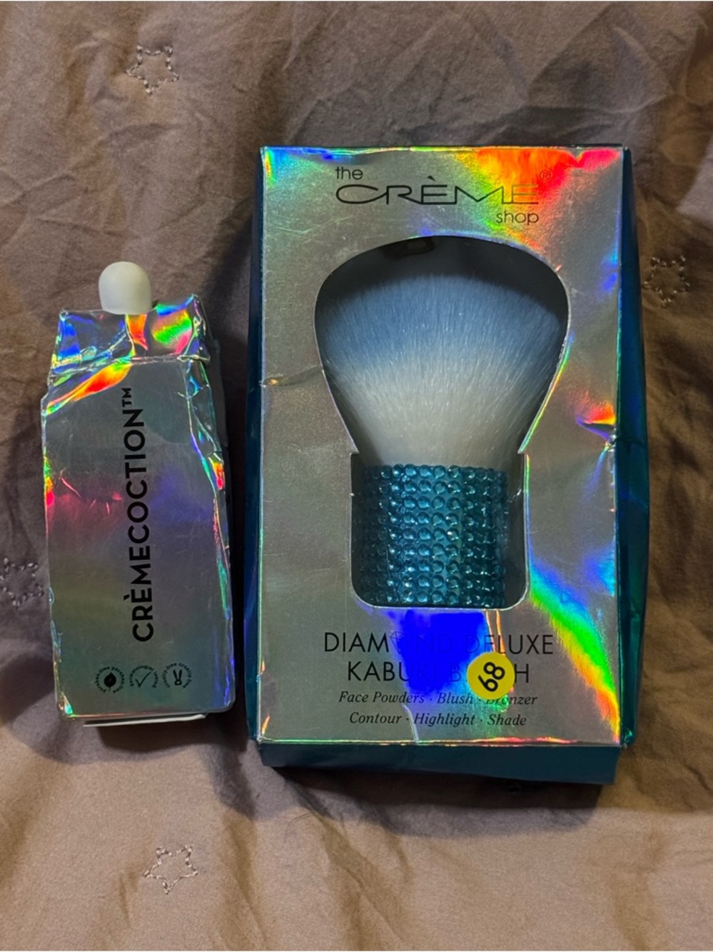 The Crème Shop Diamond Luxe Kabuki Brush with crème skin renewal ampoule serum